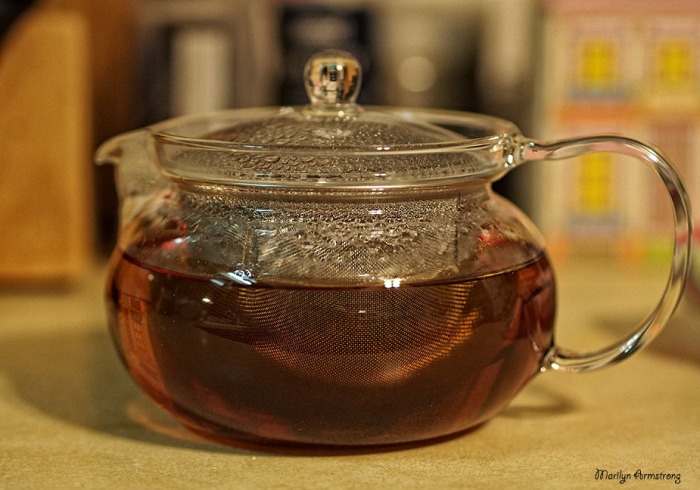 brewed tea in glass teapot