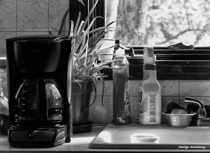 The coffee machine (though not the carafe), the bottles, the flower pot ... and the cup in the sink. Plastic.