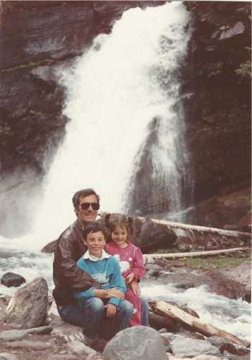 Larry and the kids at a waterfall in one of the national parks, 1989