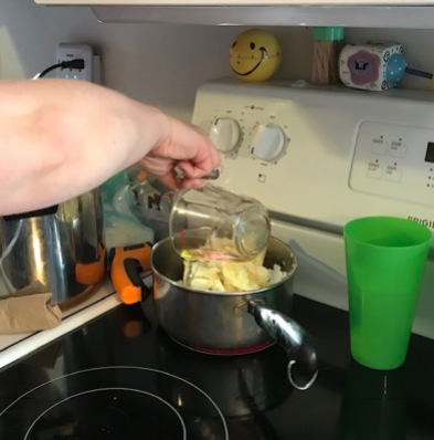 Adding ingredients to the pot