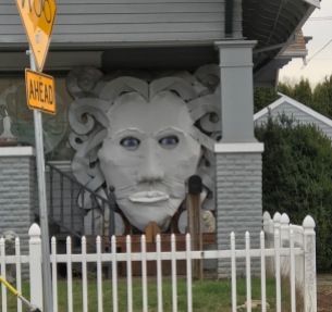 Interesting sculpture on house during the day
