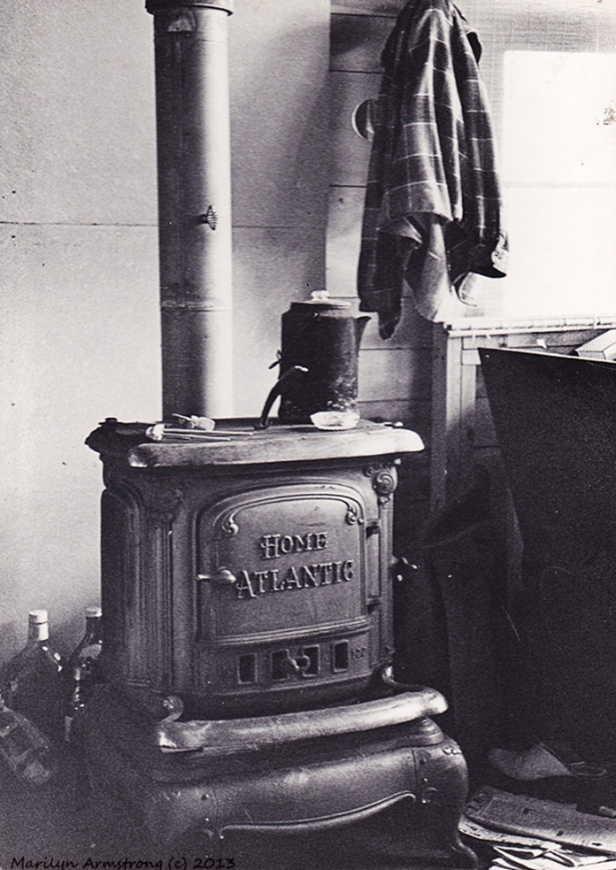 The woodstove in the cabin by Pleasant river lake. Maine, 1974
